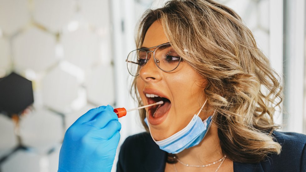 Woman being swab-tested