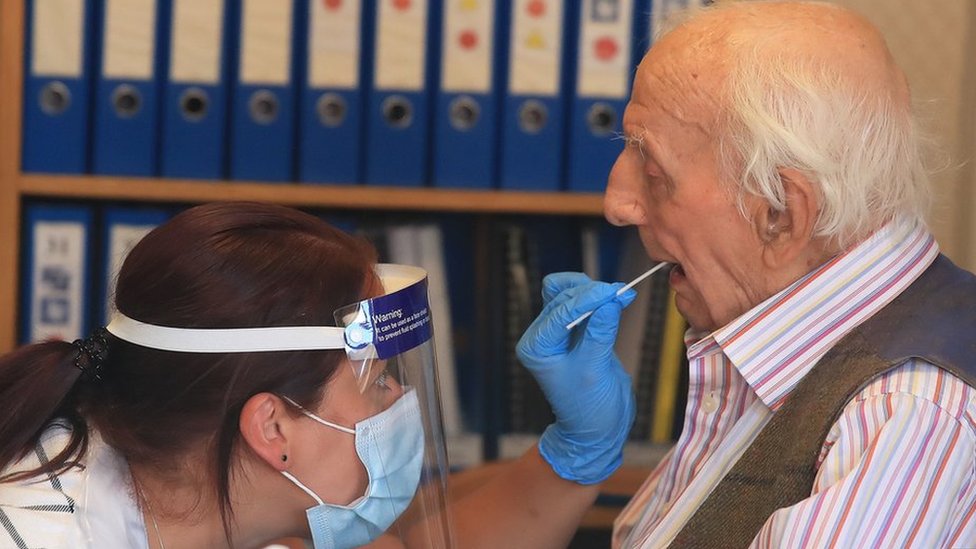 A care home resident is tested for coronavirus