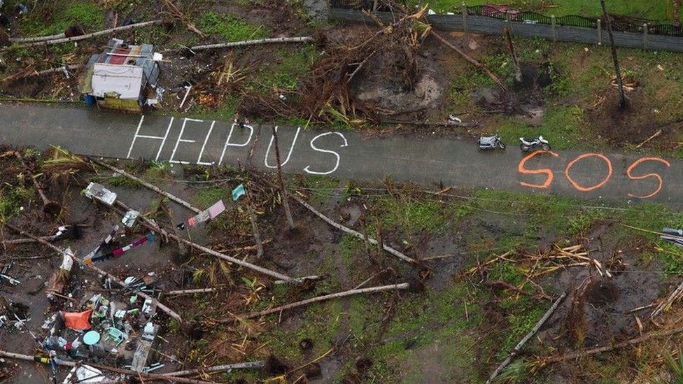 Message for help written on the road in a US town hit by a hurricane