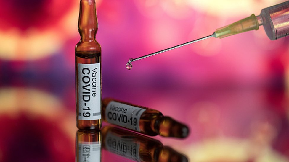 Covid-19 vaccine and syringe