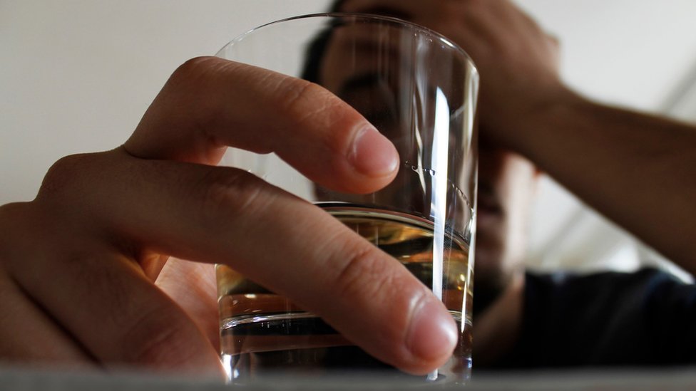 Man with glass of whisky