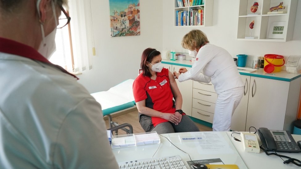 Image shows an AstraZeneca jab being given in Germany