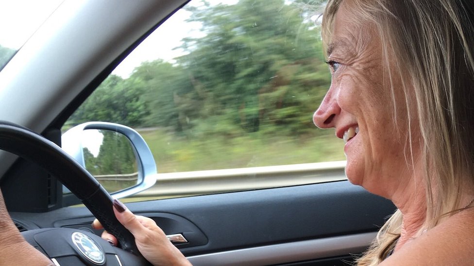 Donna driving a car