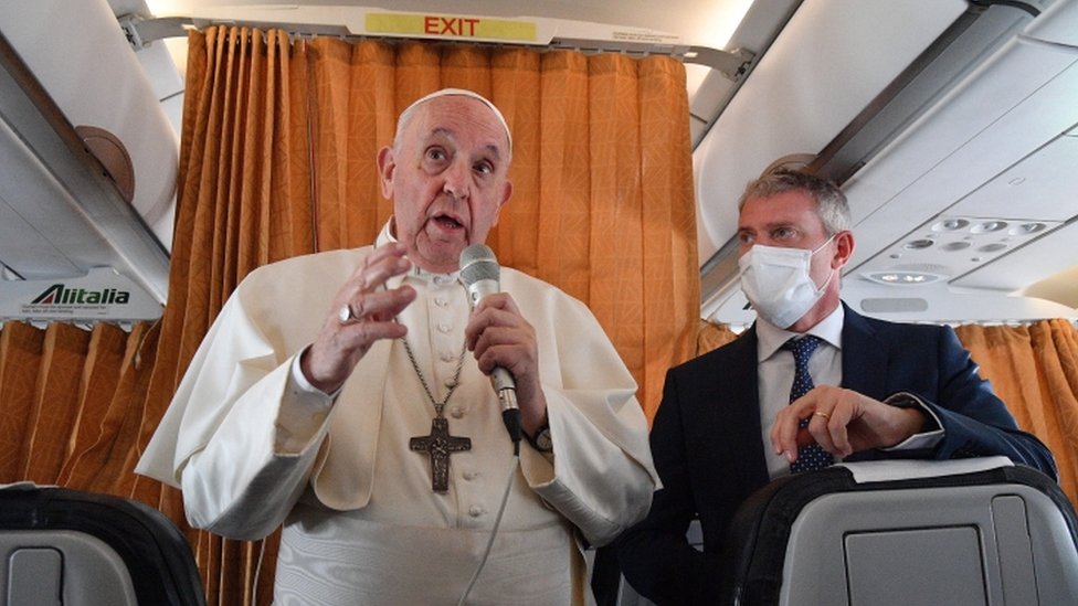 Pope Francis speaking to reporters on a plane