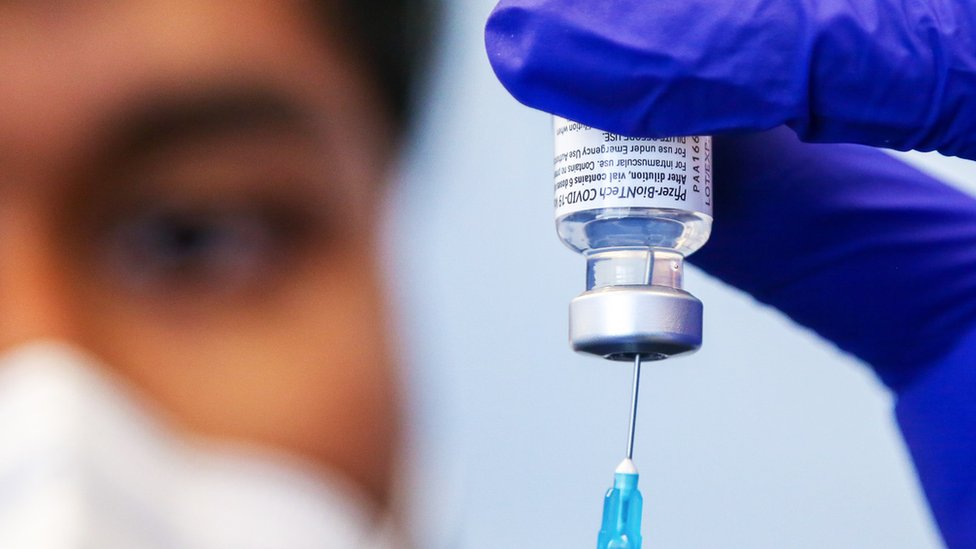 Nurse prepares a Pfizer vaccine