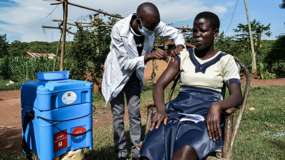 A woman receives her Covid-19 jab in Kenya