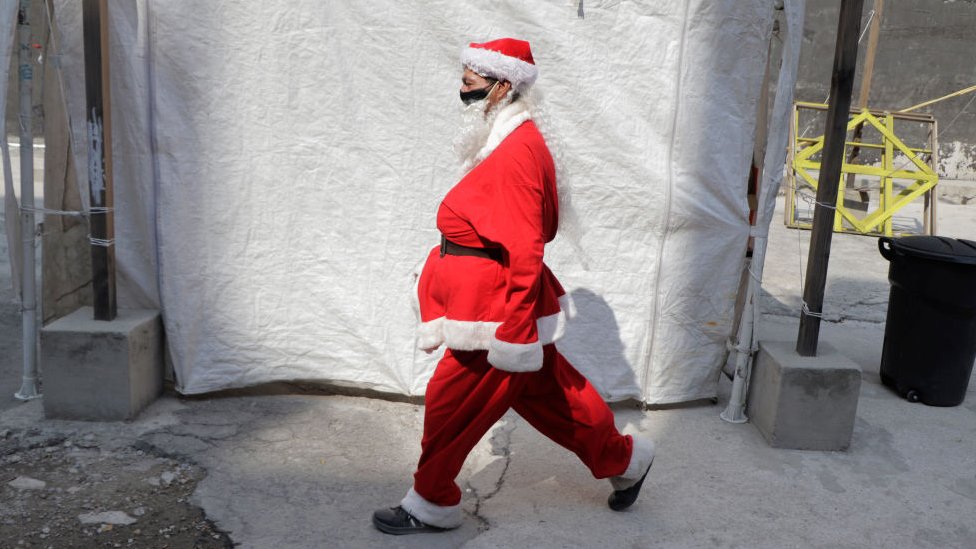 A volunteer characterized as Santa Claus to deliver food, toys and blankets to street populations and people at risk in Mexico City