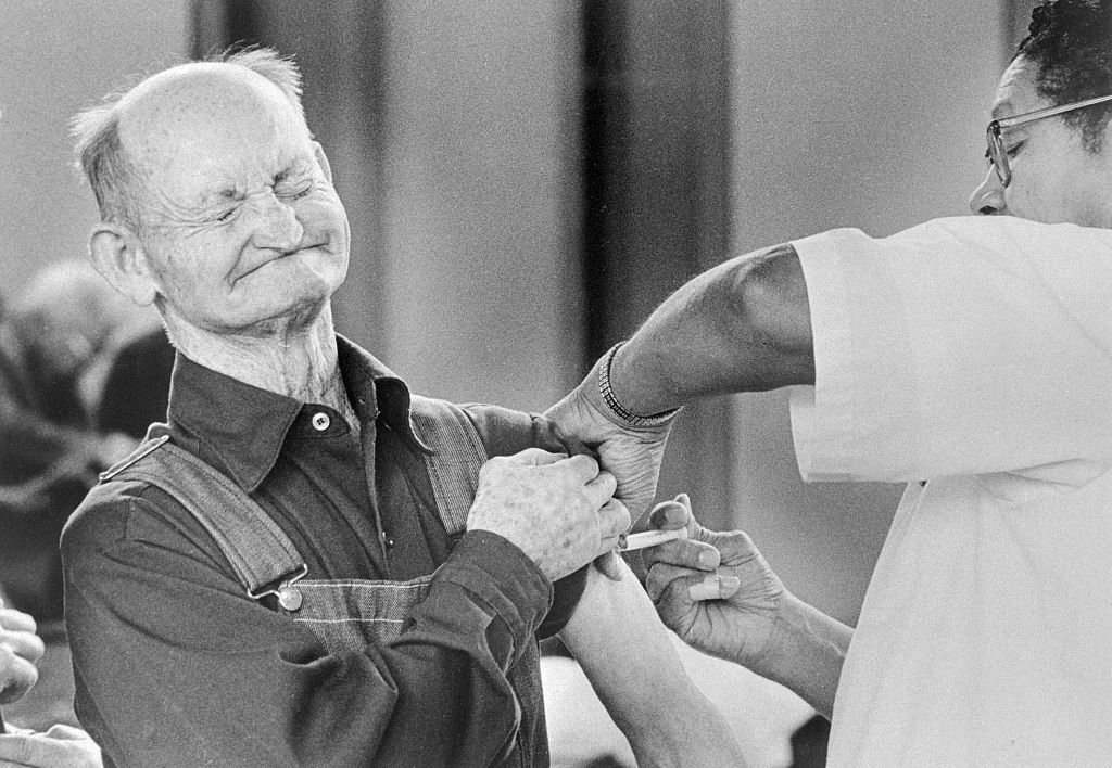 Temple Sharkey winces as he gets a swine flu shot at local clinic as public demand for a swine flu vaccine soared after a case of the disease was reported in Missouri, USA.