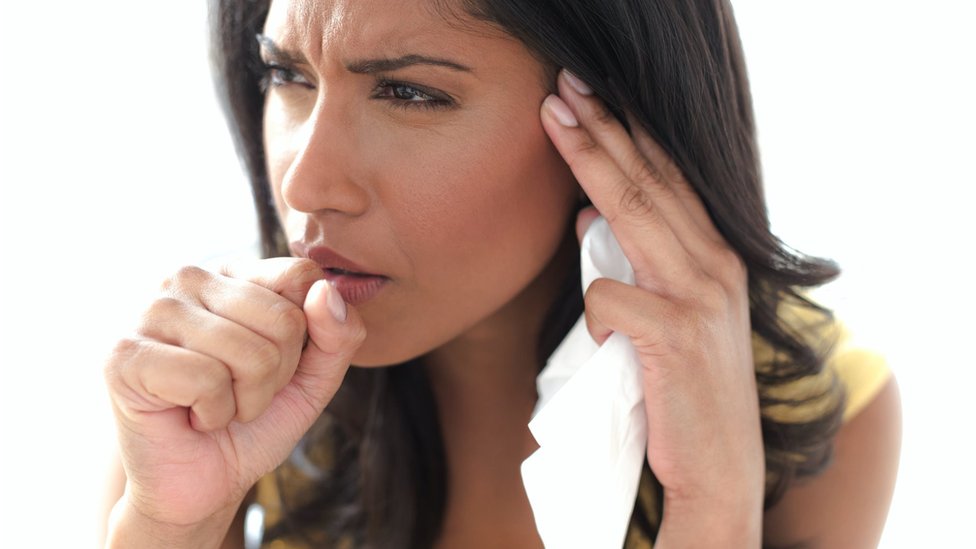 A woman coughing